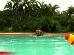 Tatooed ebony tgirl plays with good sized shemeat by pool