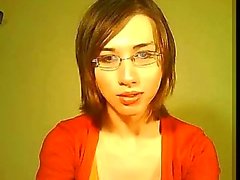 Lonely tranny in orange jerks for webcam
